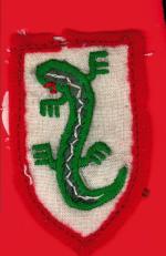 Emblemat „jaszczurki”  – noszony na mundurach w okresie powojennym