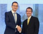 Wicepremier Mateusz Morawiecki i Steve Cohen, dyrektor zarządzający warszawskiego hubu J.P. Morgan wspólnie poinformowali o inwestycji banku.
