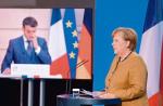 Kanclerz Angela Merkel i prezydent Emmanuel Macron w trakcie wideokonferencji w ostatni piątek 