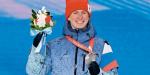 Rosyjski biegacz narciarski Denis Spicow na podium ze srebrem za bieg łączony 