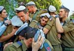 Izraelscy żołnierze podczas pogrzebu kolegi zabitego w walkach w Strefie Gazy