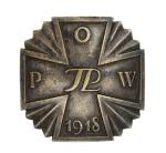 Odznaka Polskiej Organizacji Wojskowej, która co prawda podporządkowała się Tymczasowej Radzie Stanu, ale  prowadziła mimo tego niezależną działalność. Tuż przed aresztowaniem Piłsudskiego przez Niemców 22 lipca 1917 roku wielu działaczy POW, w tym Walery Sławek i Wacław Jędrzejewicz, zostało również przez Niemców aresztowanych