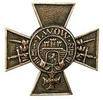 Krzyż Obrony Lwowa. Widnieje na nim odznaka orderu Virtuti Militari, którym Lwów został odznaczony za bohaterską obronę w listopadzie 1918 r.  