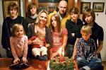 Rodzina  Horuba�&oacute;w.  Od lewej stoj�: Janek, Franek, Agnieszka, Ania, Andrzej,   Antonina i Alicja. Siedz� od lewej:  Zosia, Augustyn  i Hieronim 